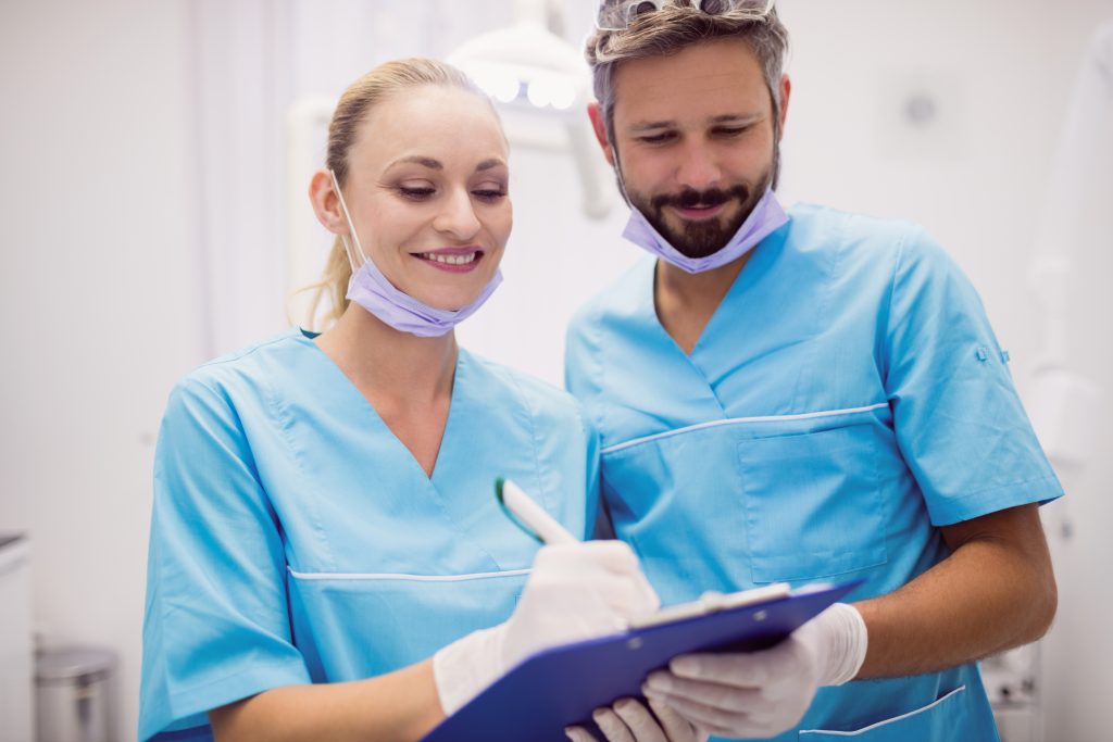 dentists interacting with each other at dental clinic