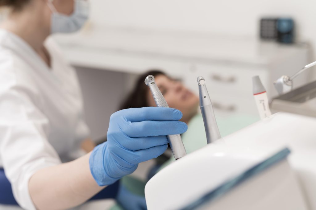 female patient having procedure done dentist